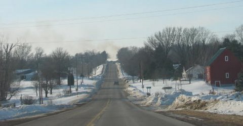 01-14-10_Harris_homes_smoke_looking_west_on_Hwy_1
